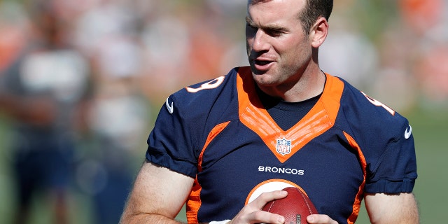 Denver Broncos quarterback Kevin Hogan looks to pass the ball during drills at the team's NFL football training camp Friday, July 19, 2019, in Englewood, Colo. (AP Photo/David Zalubowski)