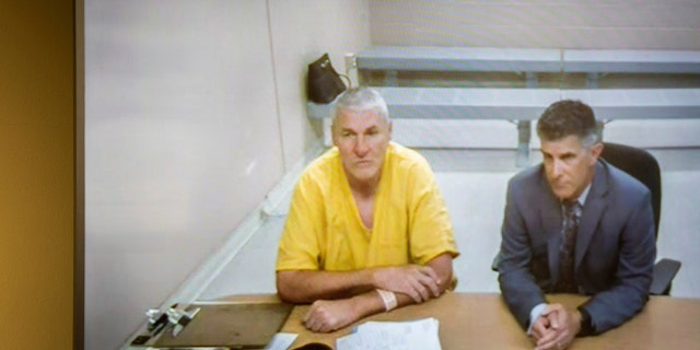 Former Washington State quarterback and Superbowl MVP Mark Rypien appears alongside defense attorney Chris Bugbee via video conference for a hearing presided over by commissioner Kristin O'Sullivan on Monday, July 1, 2019, in Spokane, Wash. (Libby Kamrowski/The Spokesman-Review via AP)