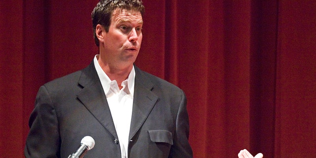 ESPN hired Ryan Leaf as a college football analyst, which is another milestone in the remarkable return of the former Washington State star who fought against drug addiction and spent in jail. (Dean Hare / Moscow-Pullman Daily News via AP, File)