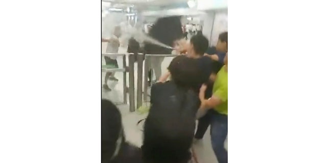 Protesters trying to return home in Hong Kong were attacked inside a train station by assailants who appeared to target the pro-democracy demonstrators.