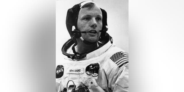 File Photo - Neil Armstrong, Commander of Apollo 11, speaks to a technician during a pass at Kennedy Space Center, Cape Canaveral, Florida, just before he sat down for the moon with other astronauts Michael Collins and Edwin & # 39; Buzz & # 39; Aldrin.
