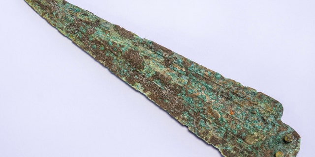 A spear head dated to the middle bronze period. which was buried as burial offering in a warrior's tomb. (Photo: Yaniv Berman, Israel Antiquities Authority)