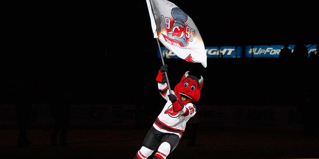 The mascot for the NHL's New Jersey Devils is shown skating across the ice.