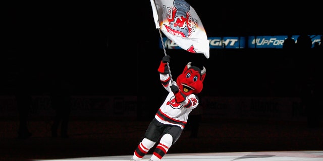 The mascot for the NHL's New Jersey Devils is shown skating across the ice.