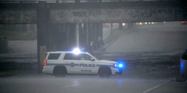 An NOPD cruiser blocks the underpass at S. Carrollton Ave. in New Orleans as severe thunderstorms caused street flooding, Wednesday, July 10, 2019.