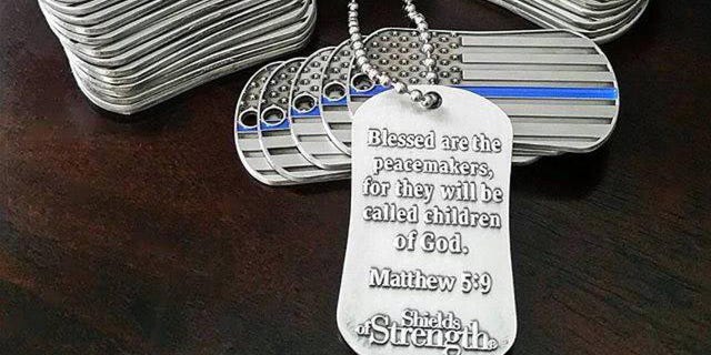 The Thin Blue Line Shields of Strength is given to law enforcement officers inscribed with Matthew 5:9, which says "Blessed are the peacemakers, for they will be called children of God."