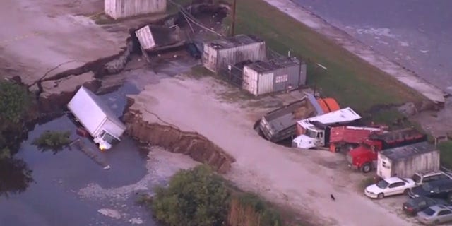 Several trucks ended up in a possible sinkhole near Orlando International Airport early Wednesday.