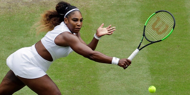 United States' Serena Williams earnings to United States' Alison Riske in a Women's quarterfinal singles compare on day 8 of a Wimbledon Tennis Championships in London, Tuesday, Jul 9, 2019. (AP Photo/Ben Curtis)