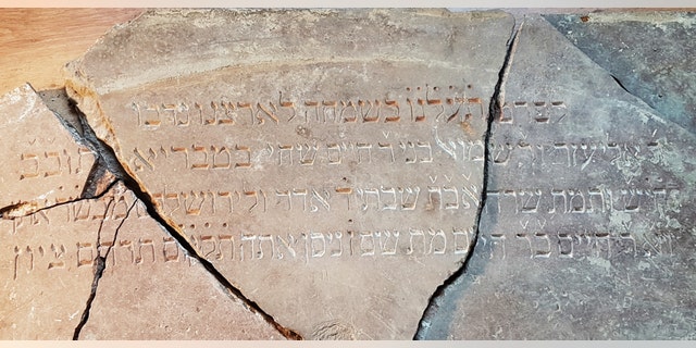 The inscription was once part of a stone Torah reading table.