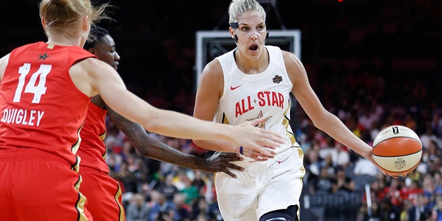 Washington Mystics' Elena Delle Donne, right, of Team Delle Donne, passes around Team Wilson during the first half of a WNBA All-Star basketball game Saturday, July 27, 2019, in Las Vegas. (AP Photo/John Locher)
