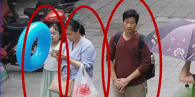 A photo shared by the Xiangshan police of Zhang with the couple.