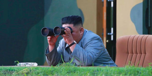 In this July 25 North Korean government photo, Kim Jong Un watching a missile test in North Korea. (Korean Central News Agency/Korea News Service via AP)