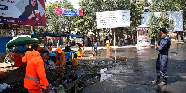 Afghan security forces stand guard near the site of an explosion in Kabul, Afghanistan, Friday, July 19, 2019. A powerful bomb exploded outside the gates of Kabul University in the Afghan capital on Friday, according to police and health officials. (AP Photo)