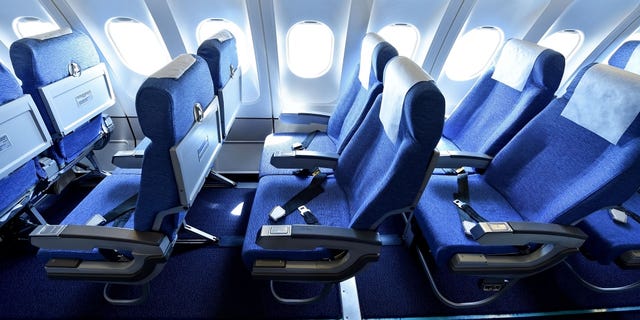 Blue airplane empty seats