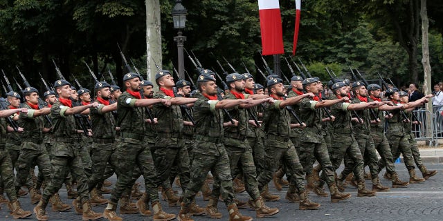 Portuguese troops take part to Bastille Day parade Sunday, July 14, 2019, on the Champs-Elysees avenue in Paris.