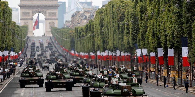 Tanks rolling on the Champs-Elysees avenue during the Bastille Day parade in Paris, France, Sunday, July 14, 2019.