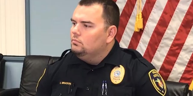 Cpl. Kenneth Brackin of the Cocoa Police Department is being credited with saving the lives of two people who had been trapped inside an overturned, submerged vehicle.