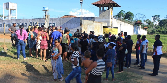 People seek information about family members who are prisoners after a riot inside the Regional Recovery Center in Altamira. (Wilson Soares/Panamazonica via AP)