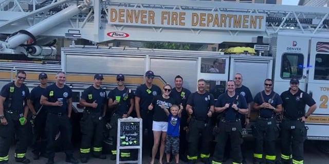 Brady Campbell and his mom Amanda with the Denver Fire Department.
