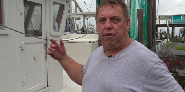 Floyd Lesseigne stands by his docked boat in Grand Isle, La. He estimates he left as much as $1,500 in profit at sea because Hurricane Barry put his business out of commission for several days. (Fox News/ Charles Watson)