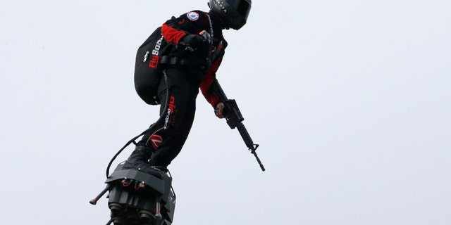 Zapata CEO Franky Zapata flies a jet-powered hoverboard or "Flyboard" during the traditional Bastille Day military parade on the Champs-Elysees avenue Avenue on July 14, 2019 in Paris, France. (Getty Images)