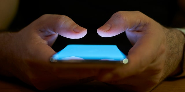 Young men using smartphone social media concept