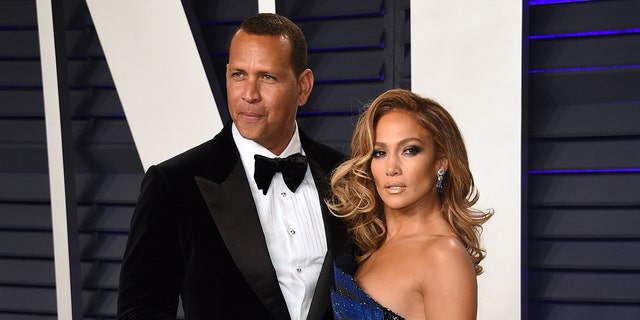 Alex Rodriguez, left, and Jennifer Lopez arrive at the Vanity Fair Oscar Party on Sunday, February 24, 2019 in Beverly Hills, Calif. (Photo by Evan Agostini / Invision / AP)