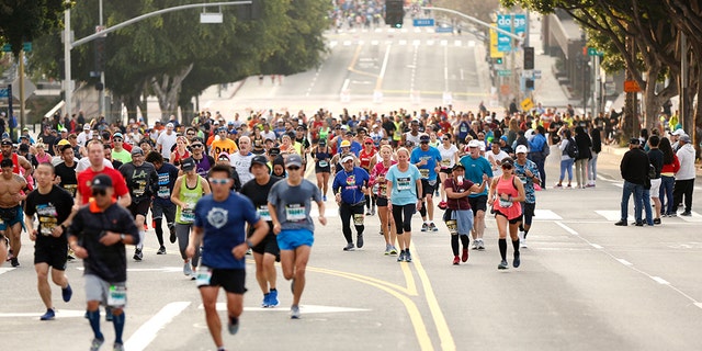 Runners climb First Street during the 2019 Skechers Performance Los Angeles Marathon March 24, 2019. (Photo by Katharine Lotze/Getty Images)