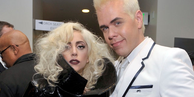 Singer Lady Gaga, left, and Perez Hilton pose backstage at the 2009 American Music Awards at Nokia Theatre L.A. Live on November 22, 2009 in Los Angeles, California.