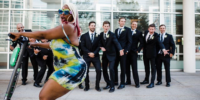 As soon as the groom and his party realized they had been photo-bombed, they tried to get her to come back and do it again – which she happily did.