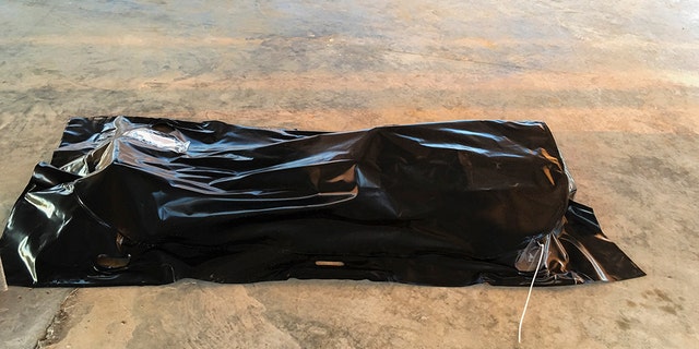 A body of a drowned migrant is seen on a coast some 100 kilometers (60 miles) east of Tripoli, Libya, Thursday, July 25, 2019. The U.N. refugee agency and the International Rescue Committee say up to 150 may have perished at sea off the coast of Libya. The country's coast guard says the Europe-bound migrants are missing and feared drowned after the boats they were traveling on capsized in the Mediterranean Sea. A spokesman says they rescued around 137 migrants on Thursday. (AP Photo/Hazem Ahmed)
