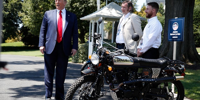 President Trump examining Janus Motorcycles during the Made in America showcase on the South Lawn of the White House. (AP Photo/Alex Brandon)
