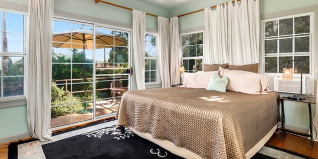 The 1,655 square foot home also features lush greenery, pink tile in one of the bathrooms.