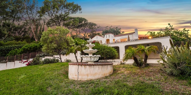 The two-bedroom home on Waverly Drive is described as "spectacular" and features an "expansive living room with gas fireplace and Italian tile floors."