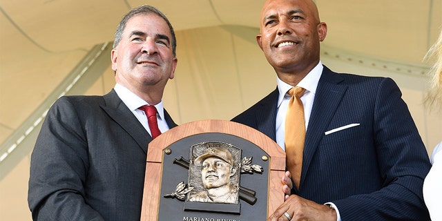 National Baseball Hall of Fame and Museum President Tim Mead, left, with inductee Mariano Rivera on Sunday in Cooperstown. (AP Photo/Hans Pennink)