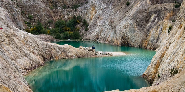 An image of the Monte Neme waters in the Galicia region of Spain. Local activists are urging government officials to intervene after multiple tourists have been reportedly hospitalized after swimming in the Instagram-famous lake.