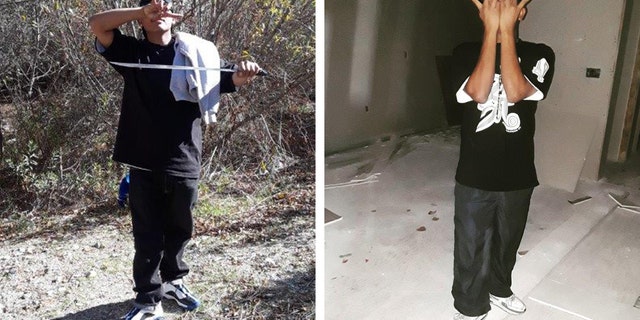 Prosecutors say photos show MS-13 gang member standing in the woods holding a machete and flashing a gang sign and flashing a gang sign