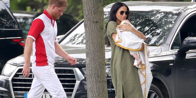 Prince Harry, Duke of Sussex, Meghan, Duchess of Sussex and his Archie Harrison Mountbatten-Windsor waits for The Royal Power King Charity Polo Day at Billingbear Polo Club on July 10, 2019 in Wokingham, England.