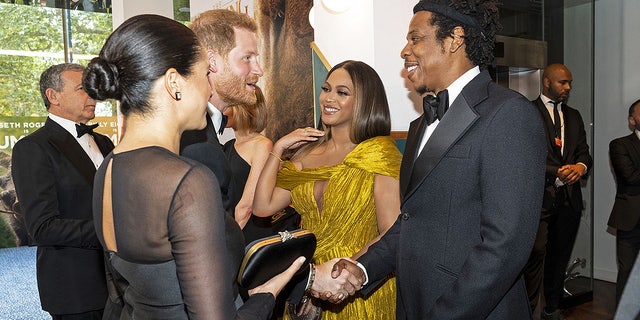 Prince Harry and Meghan Markle greet Beyoncé and Jay-Z at the London premiere of '​​​​​The Lion King.'