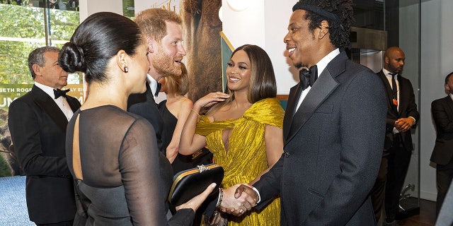 Prince Harry and Meghan Markle greet Beyoncé and Jay-Z at the London premiere of 