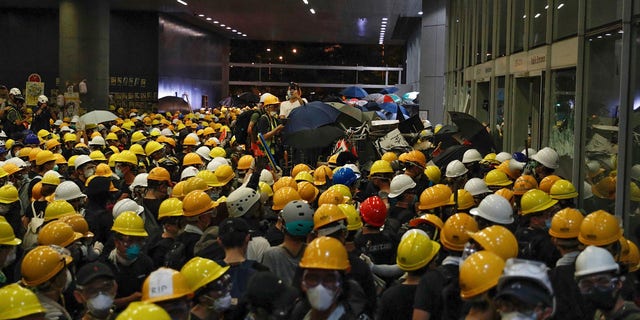 Protesters gather outside the Legislative Council as they stage a rally in Hong Kong, Monday, July 1, 2019.