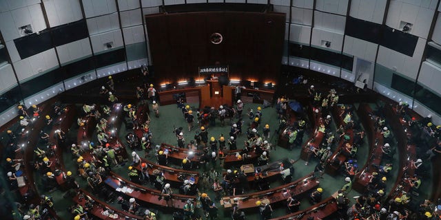 Protesters gather inside the meeting hall of the Legislative Council in Hong Kong, Monday, July 1, 2019.