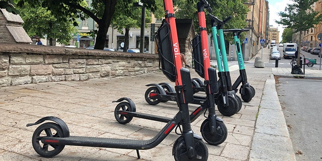 Electric scooters from Swedish startup VOI and Belin-based Tier sit parked side-by-side in Stockholm, Sweden Sunday.