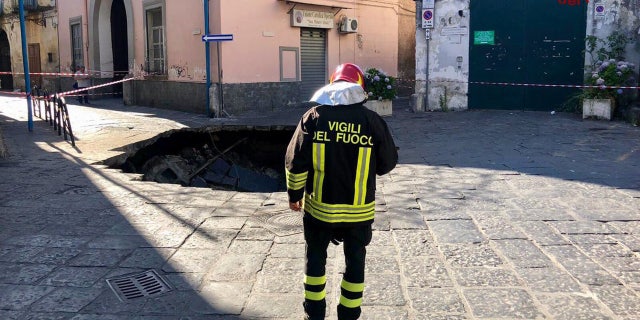 Italian firefighters said the massive sinkhole in Naples was about 26 feet wide and 40 feet deep.