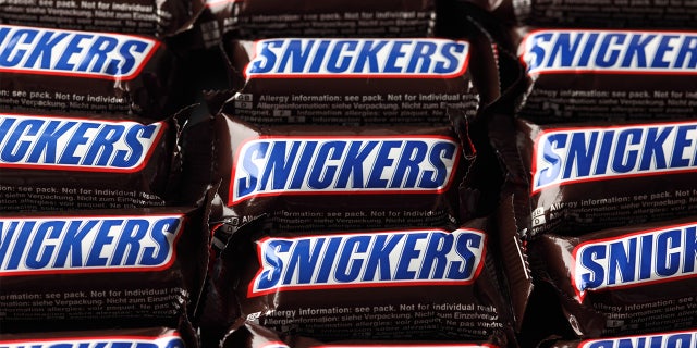 Snickers candy bars are made with nougat, caramel, peanuts and chocolate.