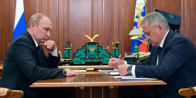 Russian President Vladimir Putin listens to Russian Defense Minister Sergei Shoigu during their meeting in the Kremlin in Moscow, Russia, Tuesday, July 2, 2019. (Alexei Druzhinin, Sputnik, Kremlin Pool Photo via AP)