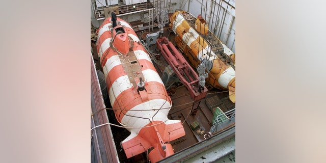 In this file photo taken on Friday, Aug. 5, 2005, a Russian mini rescue submarine, AS-34, called a Priz, left, is seen aboard the rescue ship Rudnetsky in the Barents Sea, Russia. (TASS News Agency via AP)