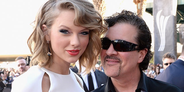 Taylor Swift and Big Machine Label Group President and CEO Scott Borchetta attend the 49th Annual Academy of Country Music Awards at the MGM Grand Garden Arena on April 6, 2014 in Las Vegas. Swift slammed Borchetta for selling the Big Machine record label to Scooter Braun, who used to represent her nemesis, Kanye West.