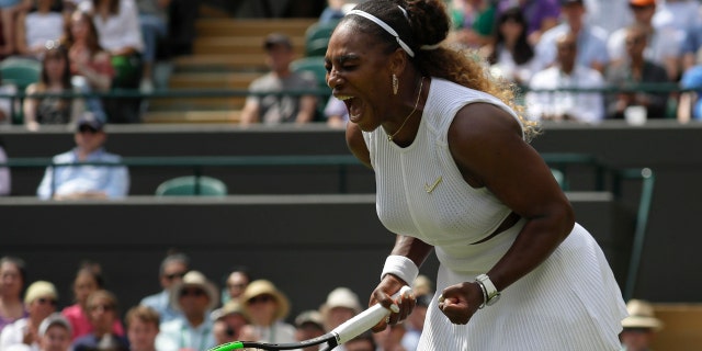 Serena Williams celebrates winning a point against Spain's Carla Suarez Navarro in a women's singles match during day seven of the Wimbledon Tennis Championships in London, July 8, 2019. (AP Photo/Kirsty Wigglesworth)
