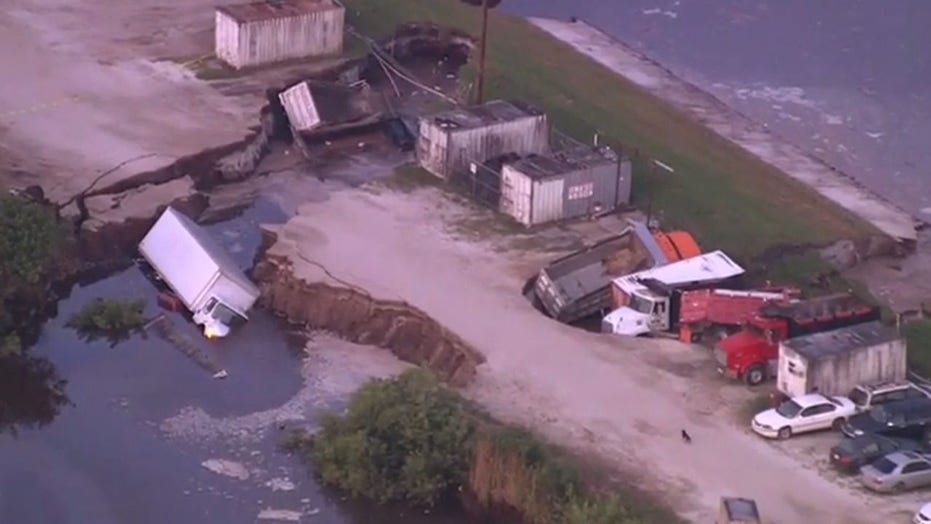Possible Sinkhole Swallows Several Trucks In Florida Near